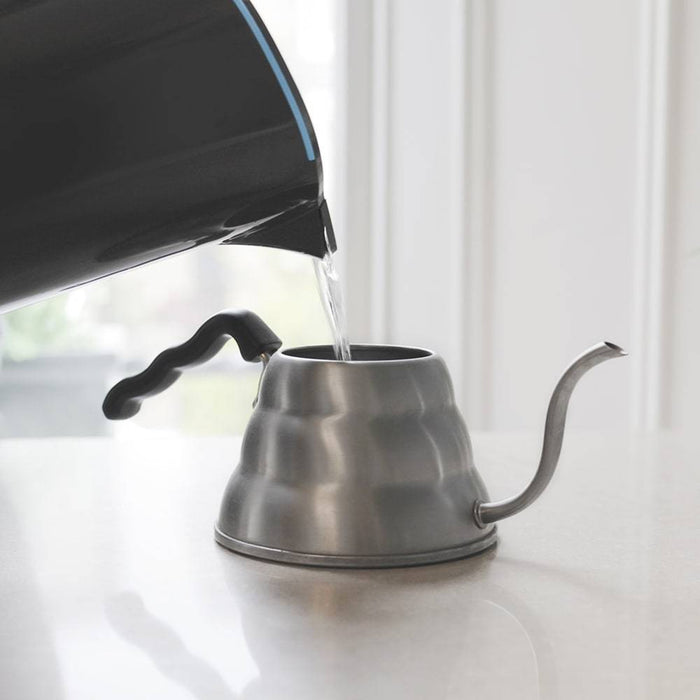 Peak Water adjustable filter jug pouring water on a coffee kettle